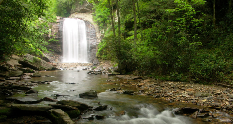 Looking Glass Falls as seen from the river downstream, beside US Hwy. 276, Pisgah National Forest, NC near Meadowbrook Log Cabin Photo by WNC Outdoors