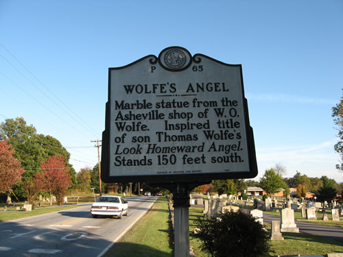 Wolfe's Angel Historic Marker Sign on US-64 at Oakdale Cemetery - Look Homeward Angel (Thomas Wolfe's Angel) - Look Homeward Angel at Oakdale Cemetery – Near Meadowbrook Log Cabin, Hendersonville, NC