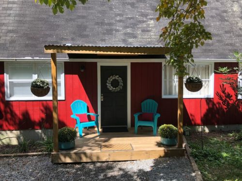 Plenty of privacy on the front porch at Apple Barn Cottage in Flat Rock, Hendersonville, NC