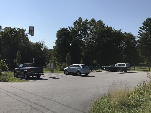 There is plenty of parking for cars and bikes. This is the parking place where the Greenway crosses Berkely Road. - Oklawaha Greenway Trail – Things to Do Near Meadowbrook Log Cabin