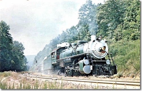 Back of Postcard Southern 4501 Southern Railway 2-8-2 4501 assaults Saluda Grade, the steepest mainline rail line, 4.7 percent, in the country at the Stop Board No. 2. The line also passes through the scenic Blue Ridge Mountains from Spartanburg, S.C. to Asheville, N.C. July 8, 1972 Photo by A.M. Langley, Jr. - Saluda and the Saluda Grade – Things to do near Meadowbrook Log Cabin
