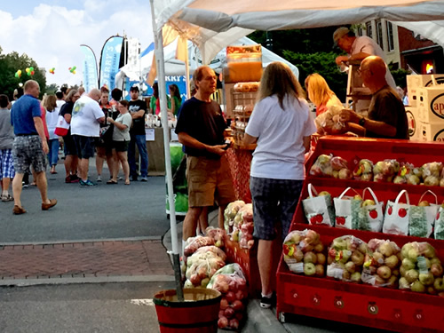 Venders set up all down Main Street selling fresh picked local apples and apple products, art, crafts and all kinds of things. - North Carolina Apple Festival - Things to do near Meadowbrook Log Cabin