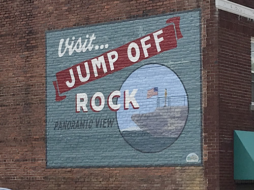 Visit Jump Off Rock Mural on the wall at Brooks Tavern