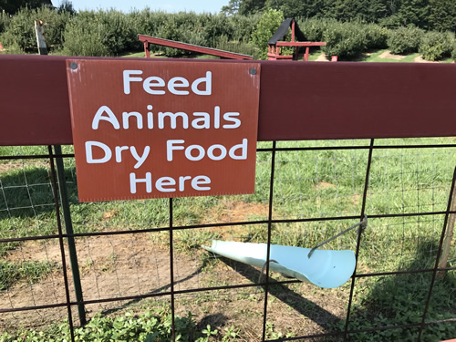 You slide the kibble down this ramp to feed the animals.
